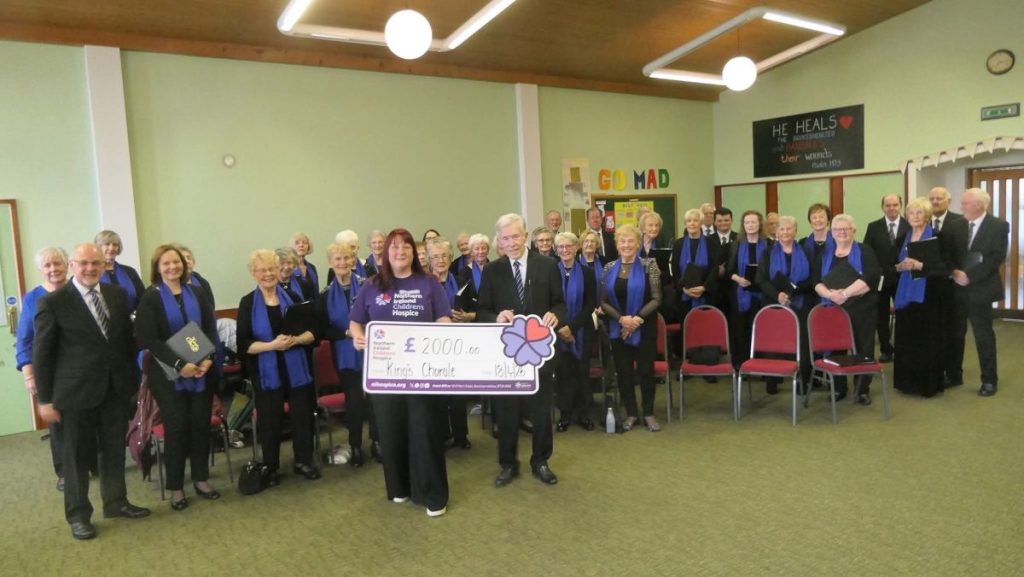 King's Chorale presenting a £2,000 cheque to Northern Ireland Children's Hospice after the Spring Concert 2026